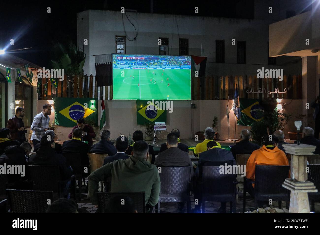 Brazilian Ambassador to Palestine watch the Brazil national team match against Switzerland in 2022 World Cup in Qatar,i n Gaza Strip, Nov 28, 2022. Stock Photo