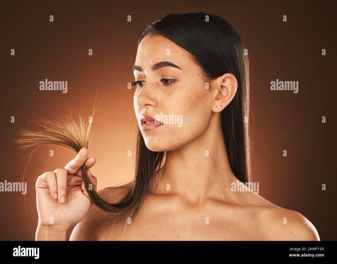 Beauty, woman and hair check for growth of split ends with worried, ponder and thinking face. Concerned skincare, body and hair care model with Stock Photo
