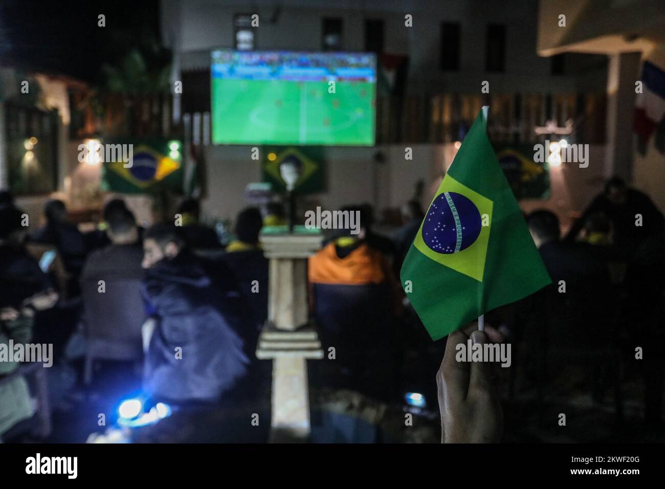 Brazilian Ambassador to Palestine watch the Brazil national team match against Switzerland in 2022 World Cup in Qatar,i n Gaza Strip, Nov 28, 2022. Stock Photo