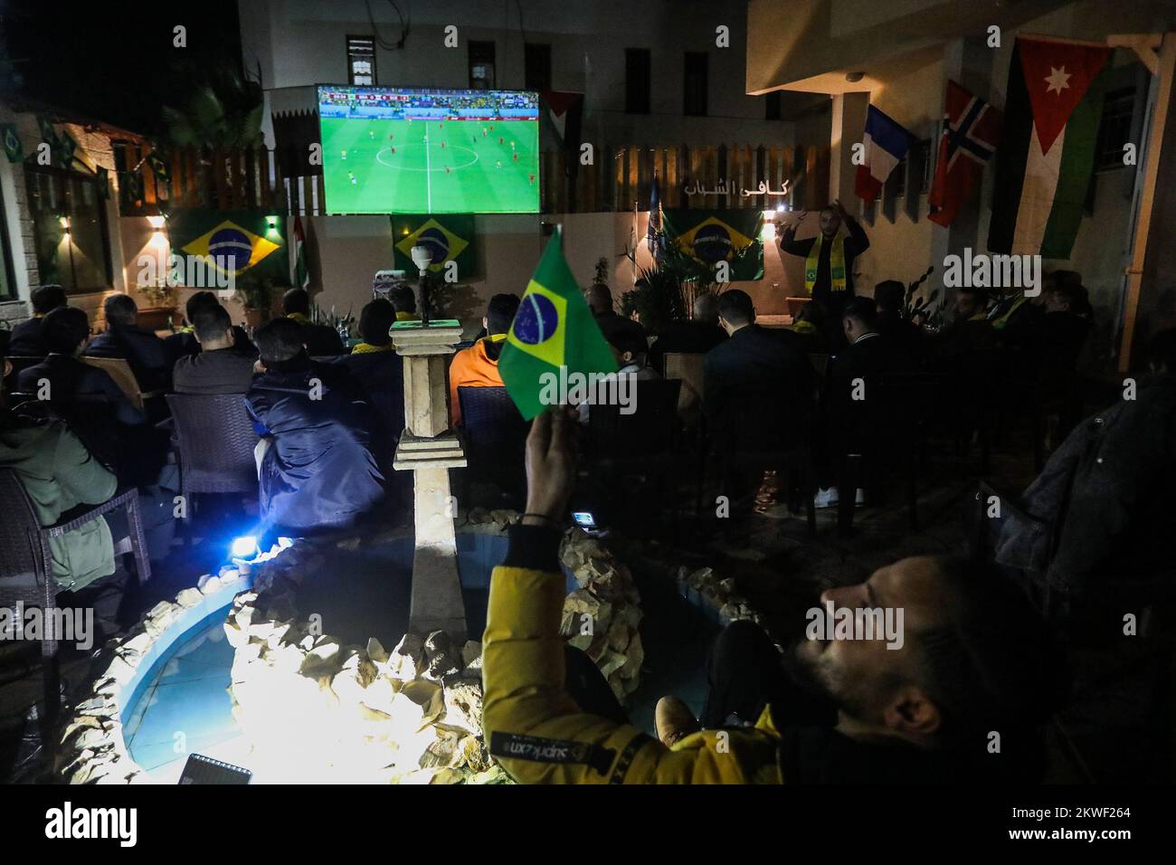 Brazilian Ambassador to Palestine watch the Brazil national team match against Switzerland in 2022 World Cup in Qatar,i n Gaza Strip, Nov 28, 2022. Stock Photo