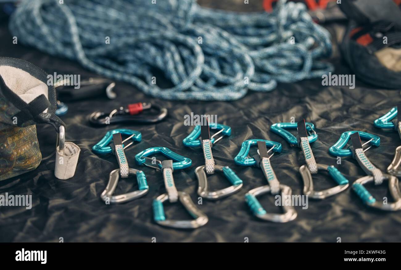 Rope safety, climbing and rock mountain sports equipment to be safe and secure. Sports tool setup zoom of carabiner an hook tools for an outdoor Stock Photo