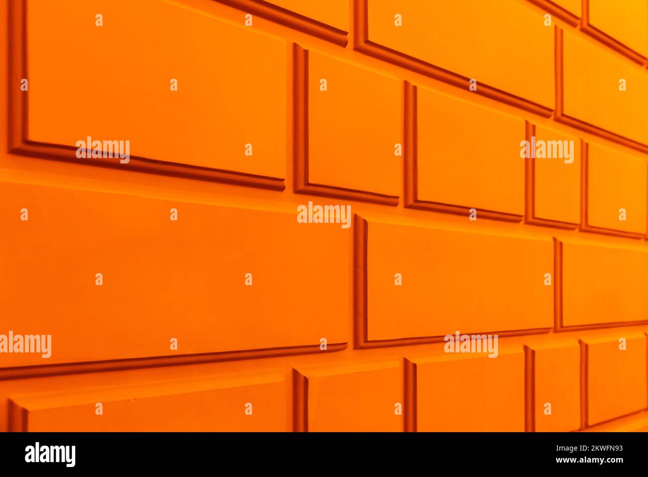 Orange wall with classic rustication pattern,  classical architecture details, perspective view Stock Photo