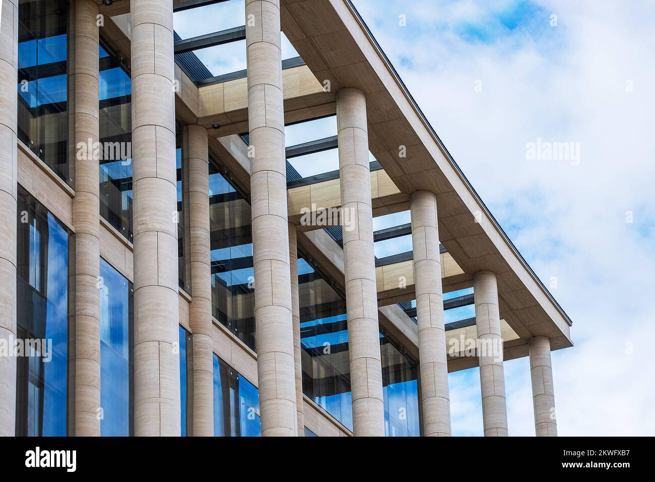 Fragment of the facade of a modern building with architectural columns Stock Photo