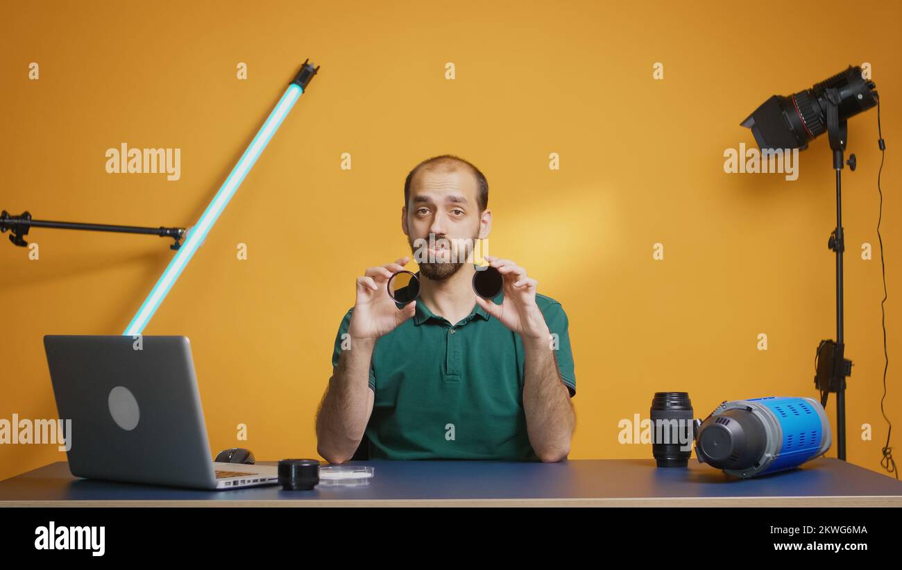 Photography blogger recording nd filter comparison for camera lenses. Variable ND filter review