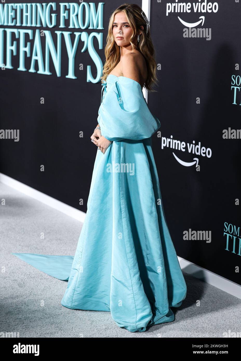 Century City, United States. 29th Nov, 2022. CENTURY CITY, LOS ANGELES, CALIFORNIA, USA - NOVEMBER 29: American actress Zoey Deutch wearing a Tiffany blue Carolina Herrera dress with Tiffany and Co. jewelry arrives at the Los Angeles Premiere Of Amazon Prime Video's 'Something From Tiffany's' held at AMC Century City 15 at Westfield Century City on November 29, 2022 in Century City, Los Angeles, California, United States. (Photo by Xavier Collin/Image Press Agency) Credit: Image Press Agency/Alamy Live News Stock Photo
