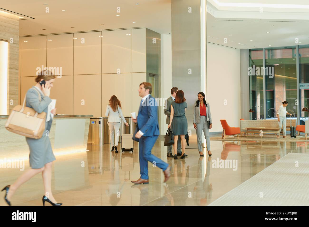 Business people, walking and an airport terminal for travel, global trade and success. Working, group and workers take steps though lobby with Stock Photo