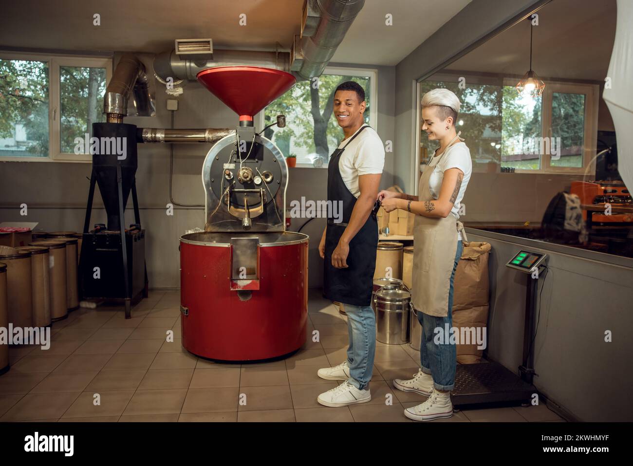 Two cheerful roast masters preparing for work Stock Photo