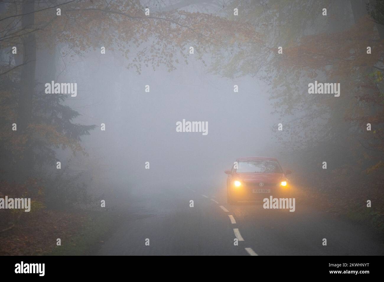 Thick fog making for difficult driving conditions on a road near the