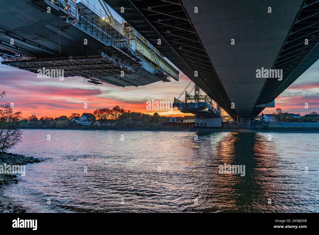 New construction of the Neuenkamp motorway bridge on the A40, over the Rhine near Duisburg, evening construction work, free cantilever assembly of the Stock Photo