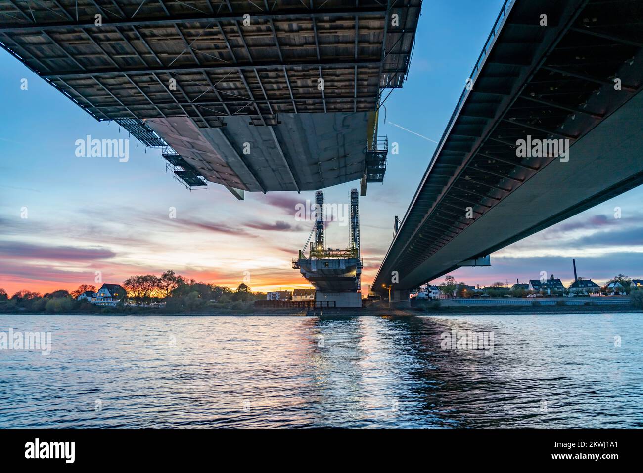 New construction of the Neuenkamp motorway bridge on the A40, over the Rhine near Duisburg, evening construction work, free cantilever assembly of the Stock Photo