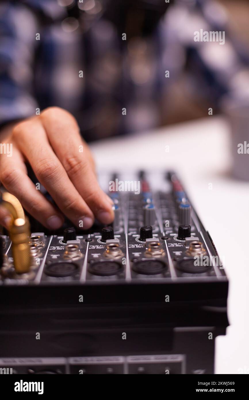 Close up of vlogger checking sound while speaking during interview. Creative online show On-air production internet broadcast host streaming live content, recording digital social media communication Stock Photo