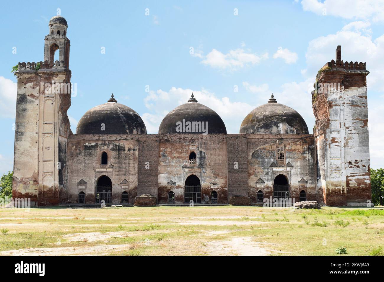 Alif Khan Masjid, Front view, build in 1325 AD, a brick structure, with 3 domes, each of 100 square feet with echo effect, constructed by Alif Khan Bh Stock Photo