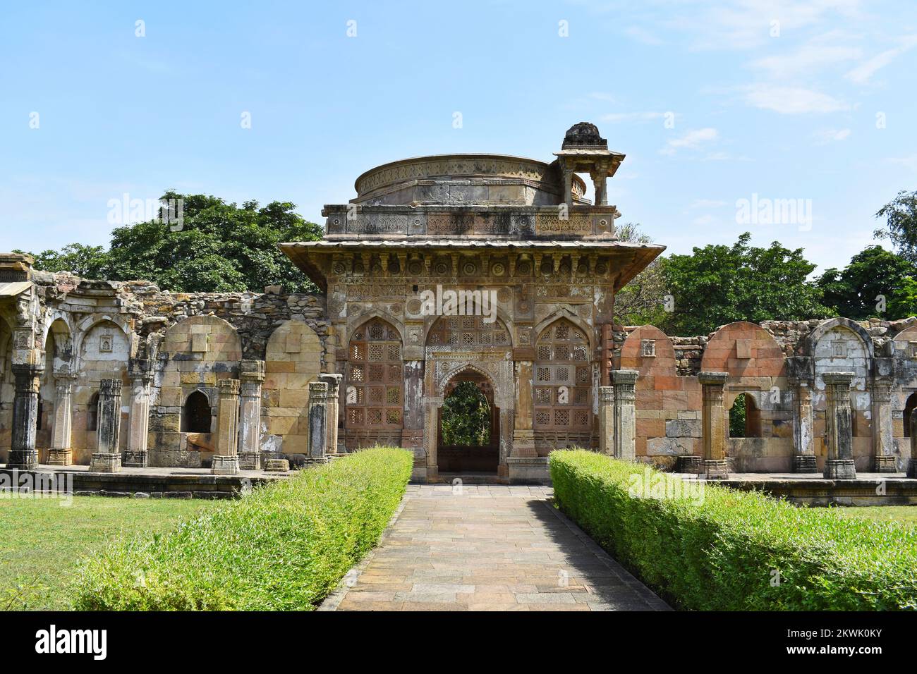 Architectural Archway and courtyard infront of Jami Masjid with intricate carvings in stone, an Islamic monuments was built by Sultan Mahmud Begada in Stock Photo