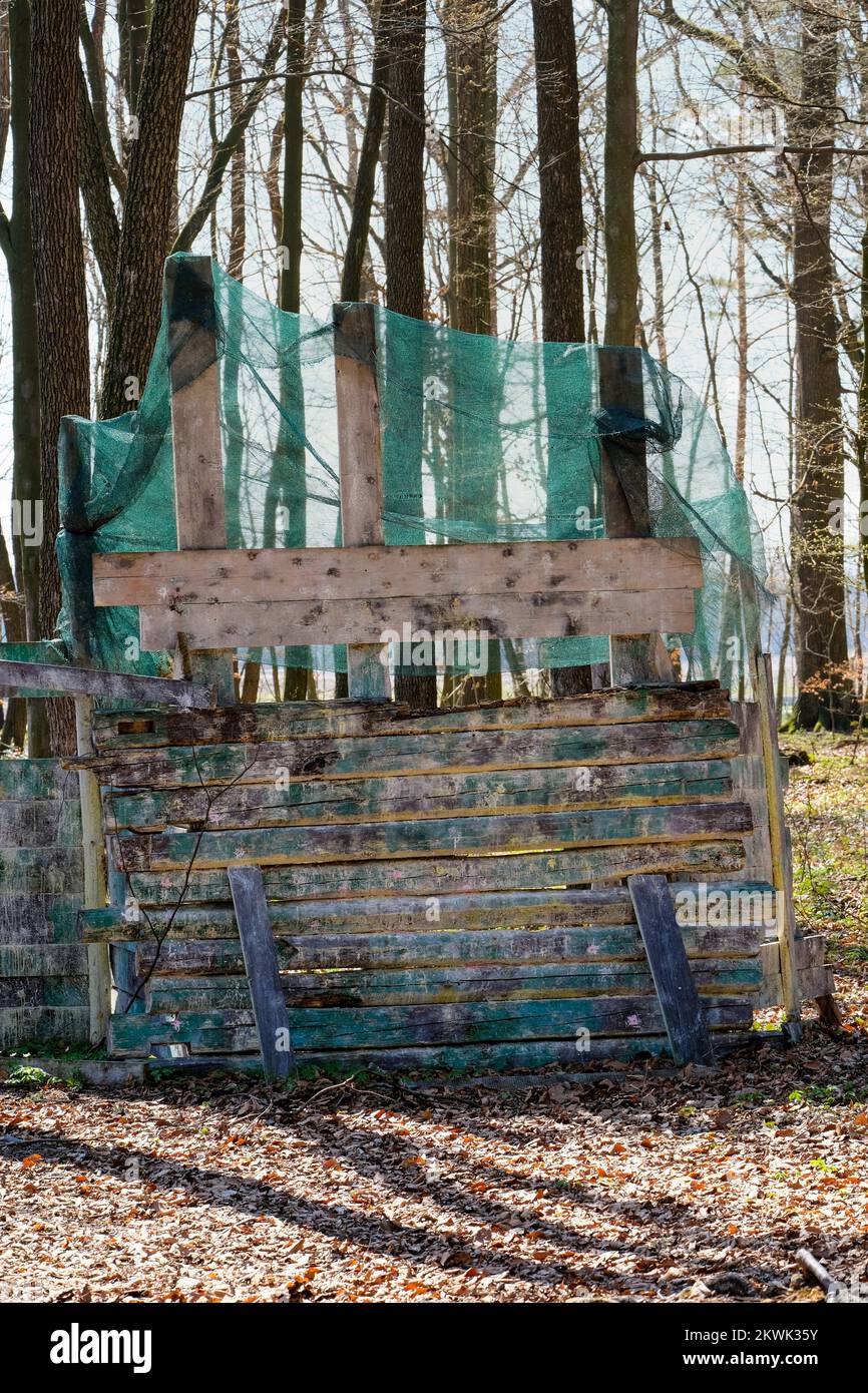 Shelter behind a wooden wall a bunker in the paintball arena, a
