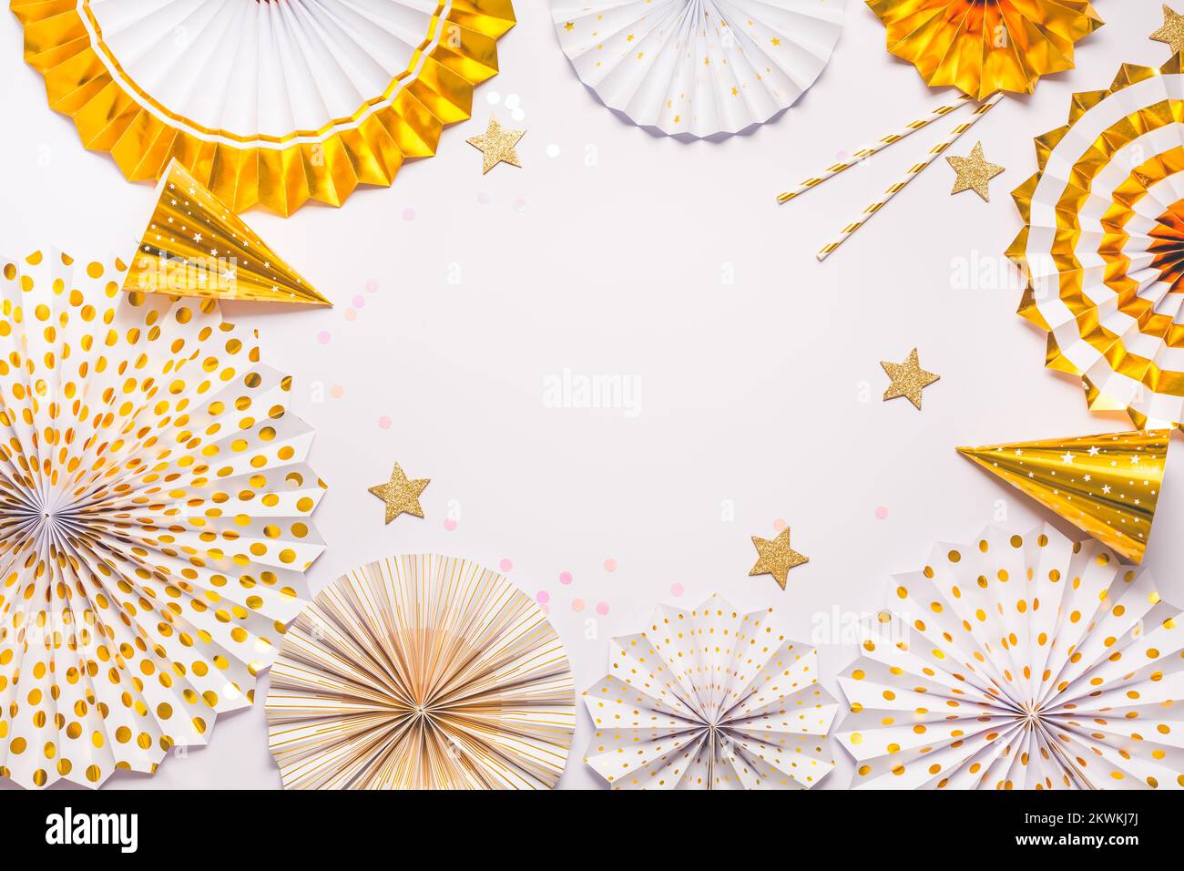 Party  background with paper fans, party decoration, party celebration in white and golden tone Stock Photo