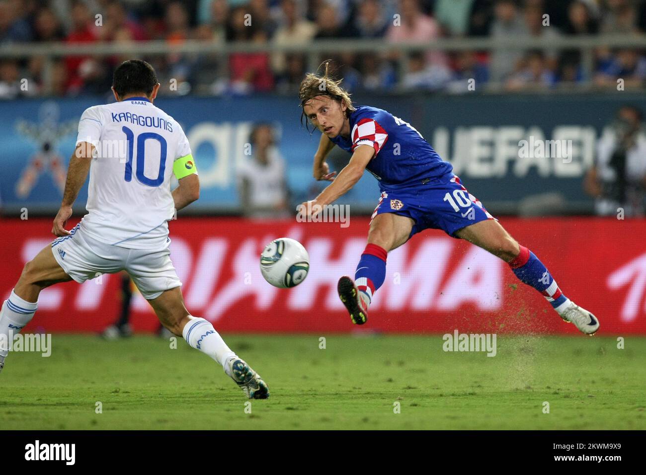 Croatia's Luka Modric vies with Greece's Georgios Karagounis  Stock Photo