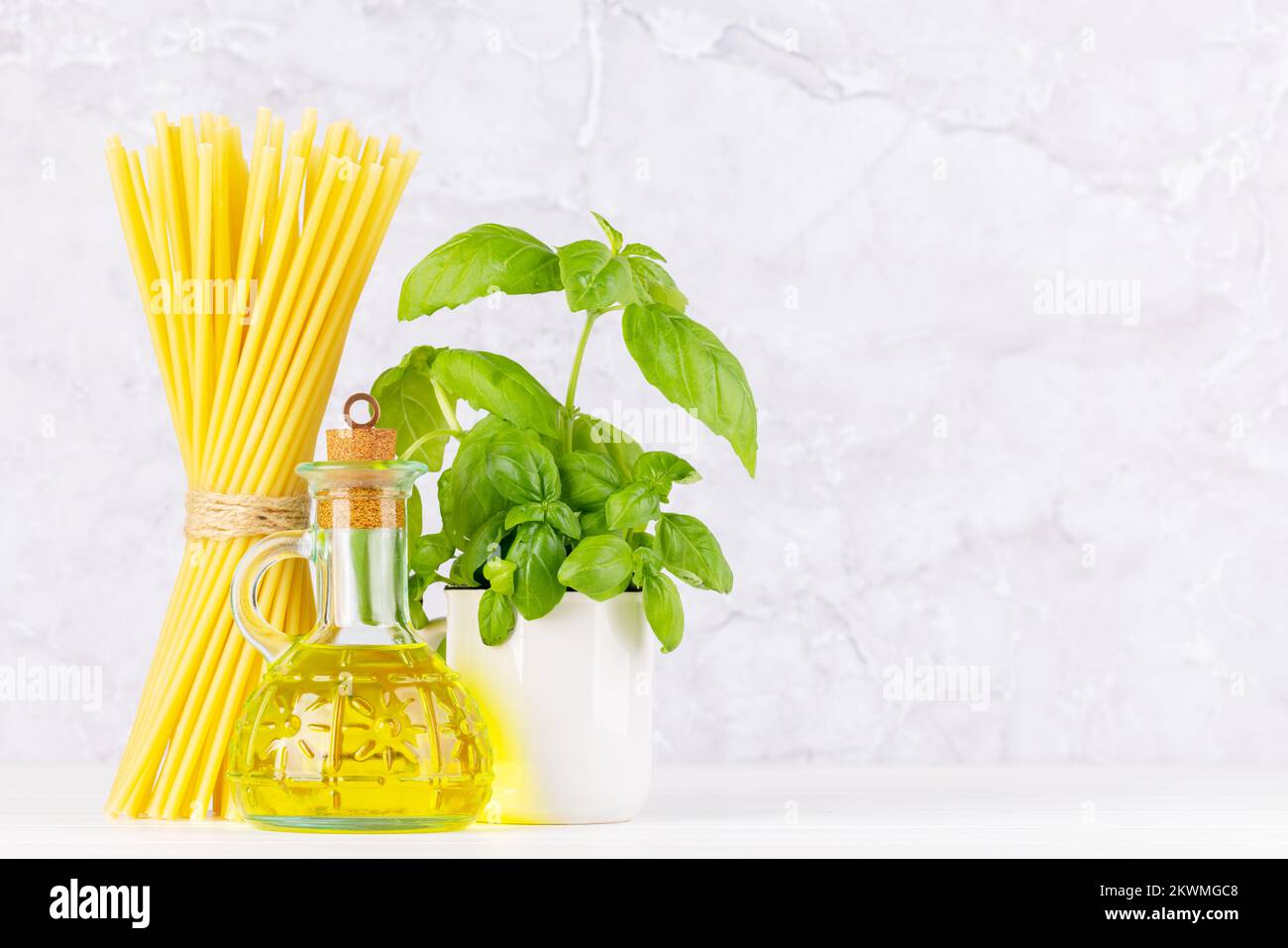 Ingredients for cooking. Italian cuisine. Pasta, olive oil, basil. With