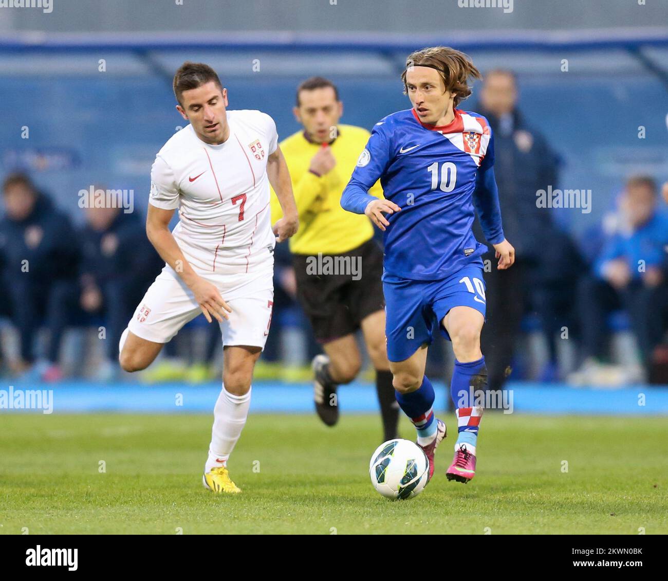 Zoran Tosic and Luka Modric battle for the ball in the 2014 World Cup qualifier between Croatia and Serbia at Maksmir Stadium in Croatia. Stock Photo