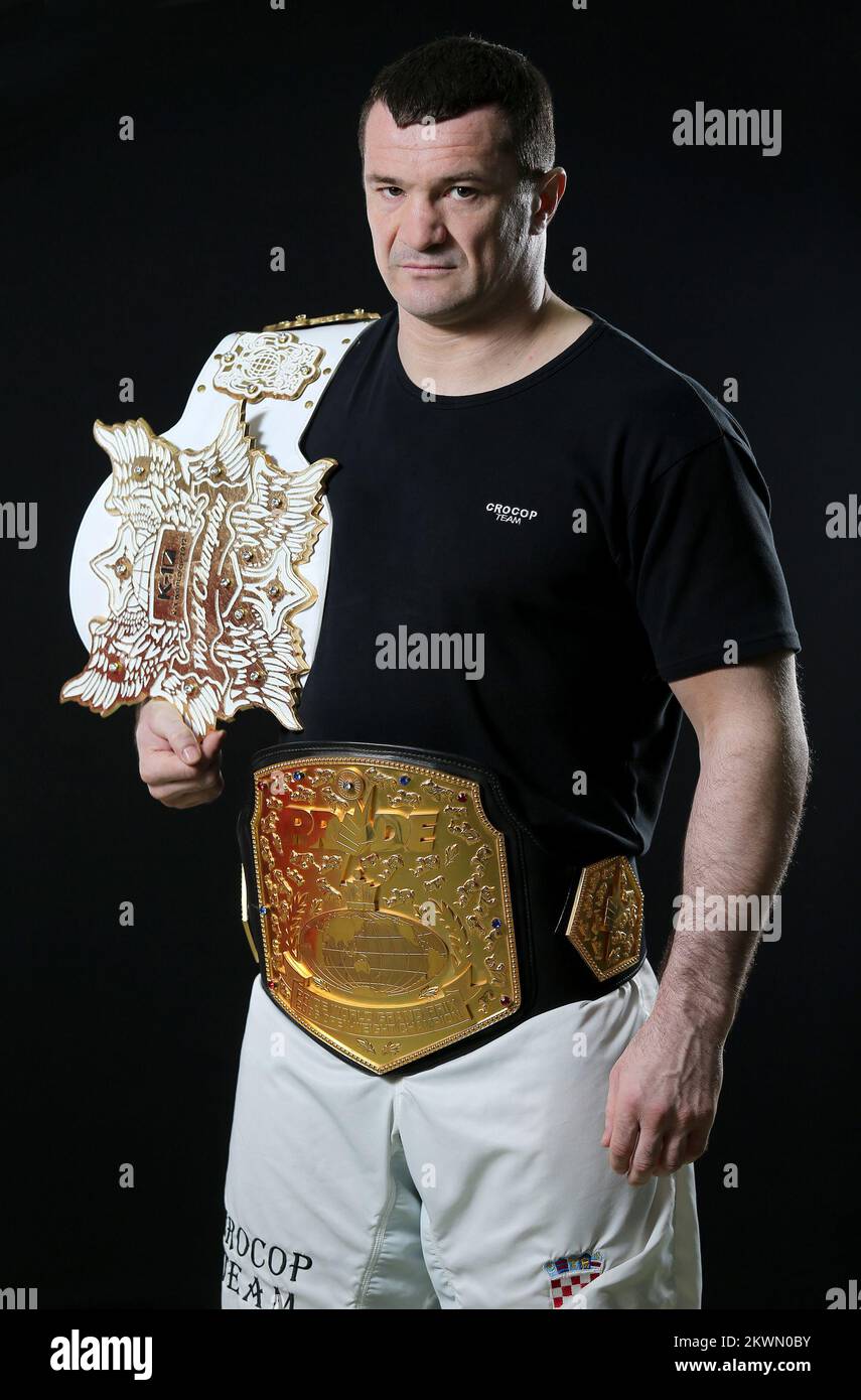 Mirko 'Cro Cop' Filipovic poses for a photograph with his two winners ...