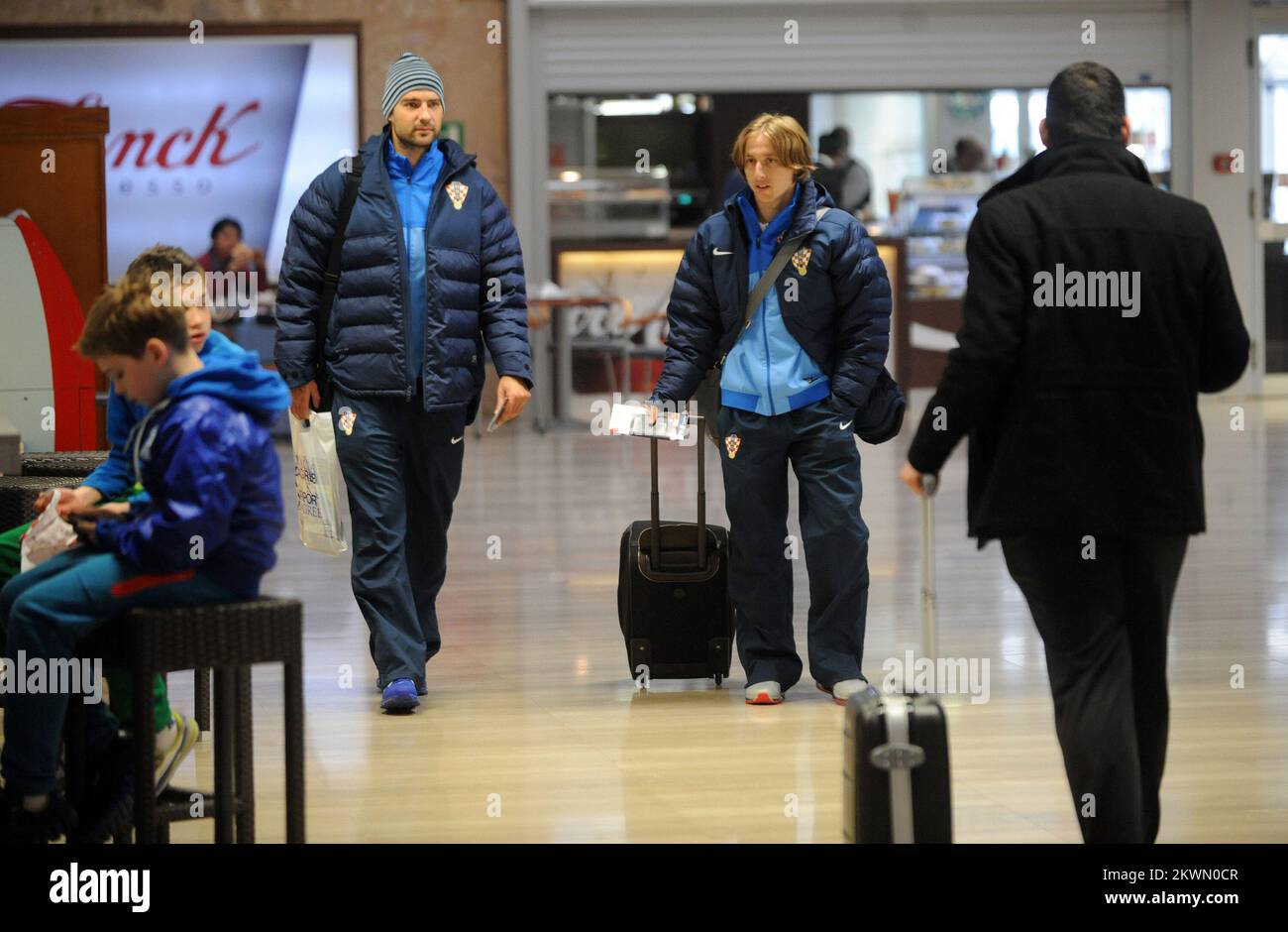 Verdrun Corluka and Luka Modric seen at Zagreb airport in Croatia in preparation for their World Cup 2014 qualifying fixture against Wales. Stock Photo