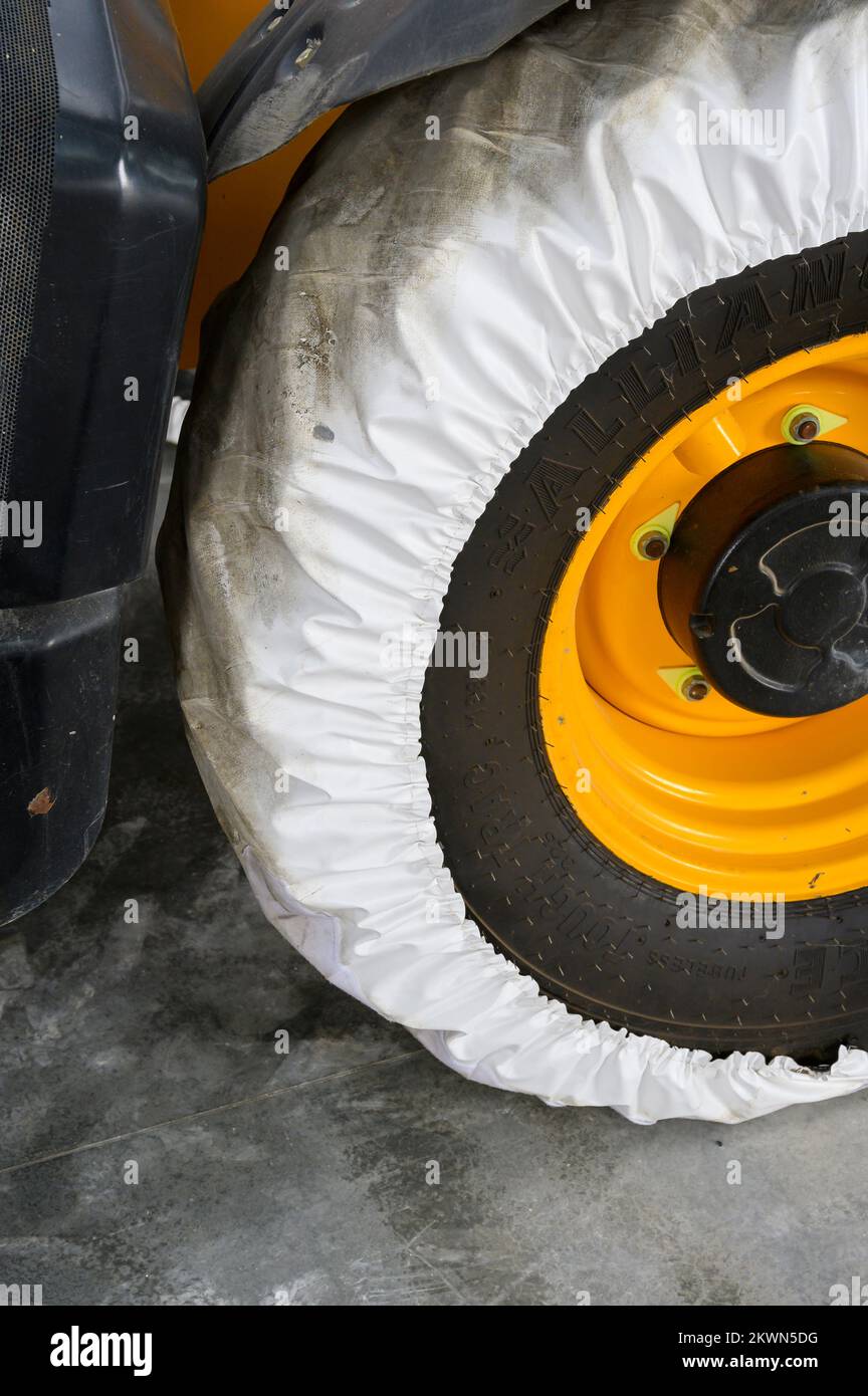 Wheel cover on heavy plant tyre Stock Photo Alamy