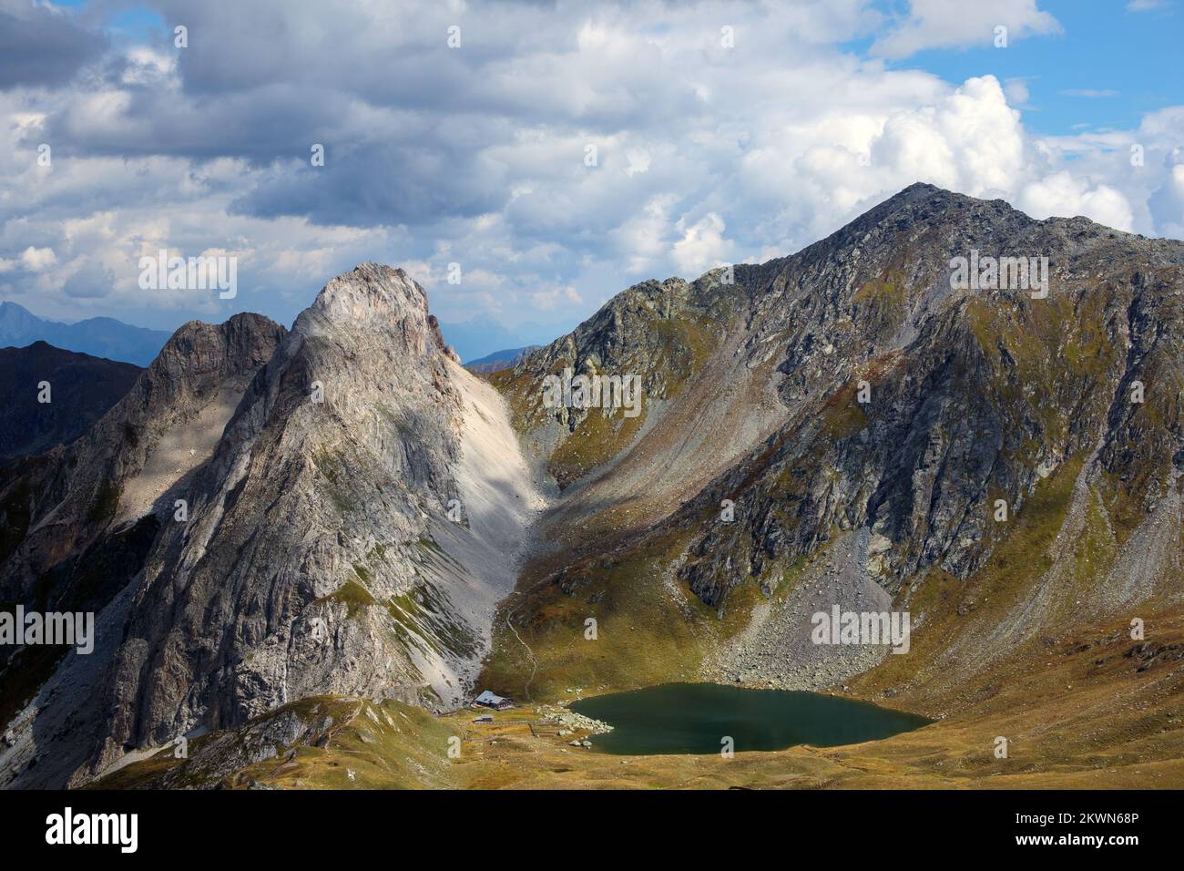 Obstansersee Hütte (refuge), Alpine lake. Rosskopf mountain peak. Carnic trail. Austria. Europe. Stock Photo