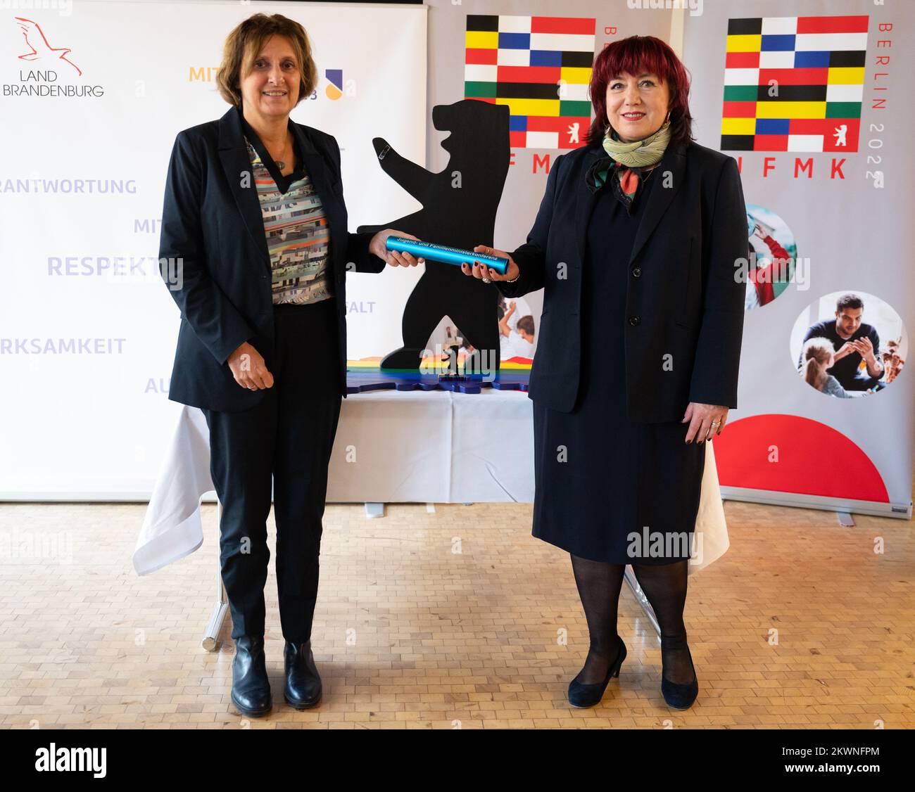 30 November 2022, Berlin: Astrid-Sabine Busse (SPD, r), Berlin Senator for Education, Youth and Family, symbolically hands over a baton of the Youth and Family Ministers Conference to Britta Ernst (SPD), Minister for Education, Youth and Sports of the State of Brandenburg, after a press conference. On January 1, 2023, Brandenburg will take over the chairmanship of the Youth and Family Ministers Conference of the Länder (JMFK) from Berlin. The JFMK is the working body of the ministers and senators responsible for child, youth and family policy. It advises and decides on matters of child, youth Stock Photo