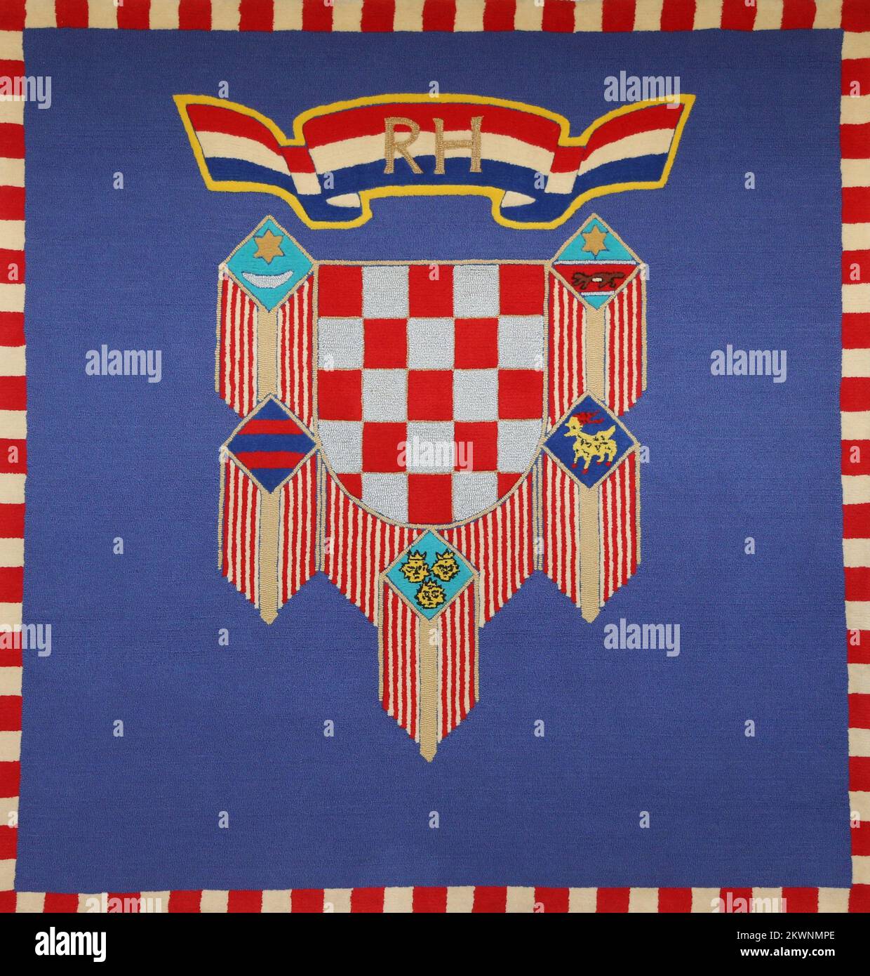 09.09.2013., Zagreb,Croatia  - Flag of the President of the Republic of Croatia is a square with the bordering edge consisting of a narrow stripe of red and white squares. The historical Croatian coat of arms containing 25 red and silver squares is situated in the middle of the flag on a blue base. The shield is decorated with a garland of medallions in which historic coats of arms of Croatian lands are arranged from left to right in the following order: the oldest known Croatian coat of arms and coats of arms of the Republic of Dubrovnik, Dalmatia, Istria, and Slavonia. Sheaves of parallel go Stock Photo