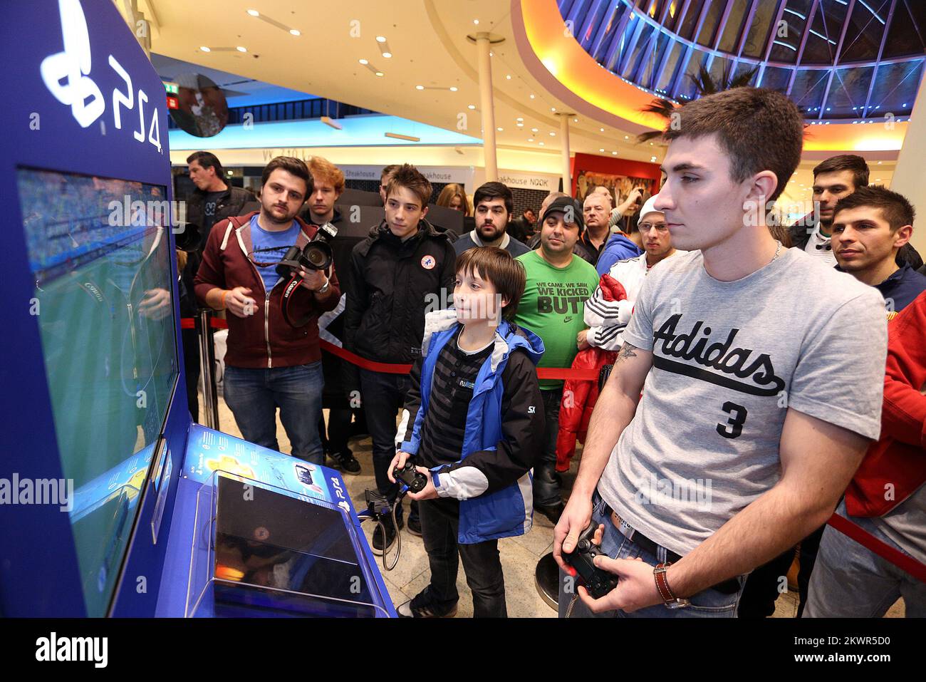 28.01.2014., Zagreb, Croatia - Tournament in playing games on Playstation 4 was held in the store Sancta Domenica. After that, at midnight started the official sale of Playstation 4. Andrija Galic was one of the winners of the tournament who won new Playstation 4 console. Photo: Anto Magzan/PIXSELL  Stock Photo