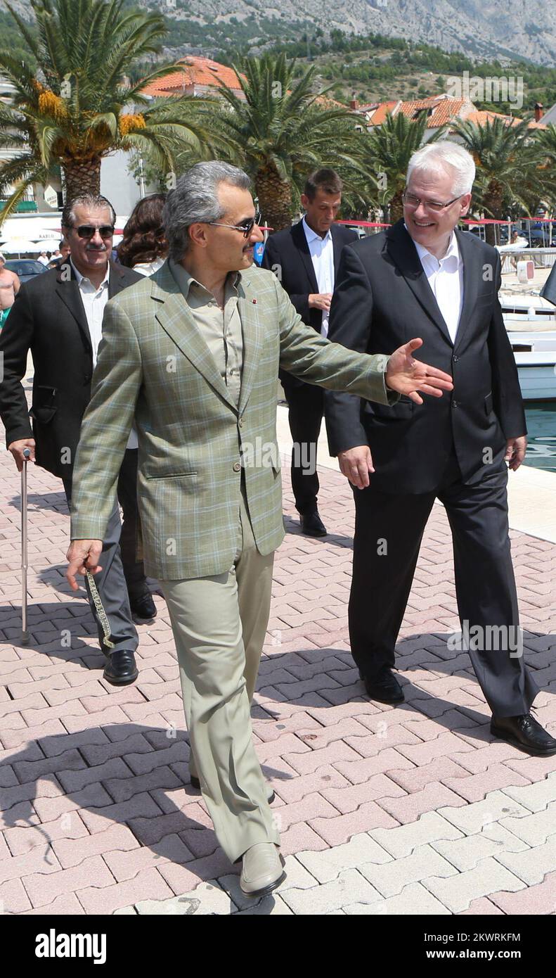 08.08.2014., Baska Voda, Croatia - Croatian President Ivo Josipovic and Prince Waleed bin Talal bin Abdul-Aziz Al Saud talked while walking on a seafront.  Stock Photo