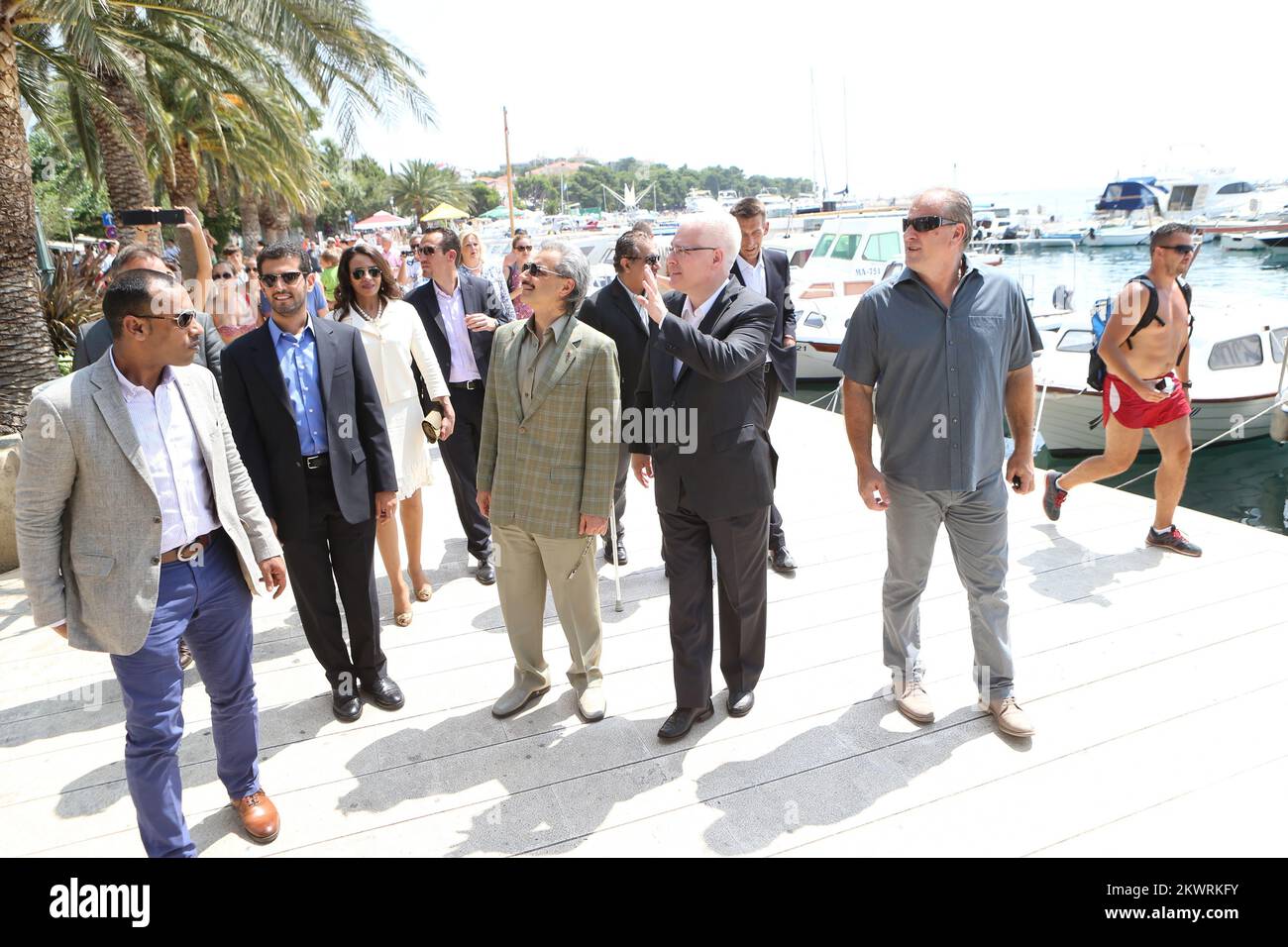 08.08.2014., Baska Voda, Croatia - Croatian President Ivo Josipovic and Prince Waleed bin Talal bin Abdul-Aziz Al Saud talked while walking on a seafront.  Stock Photo