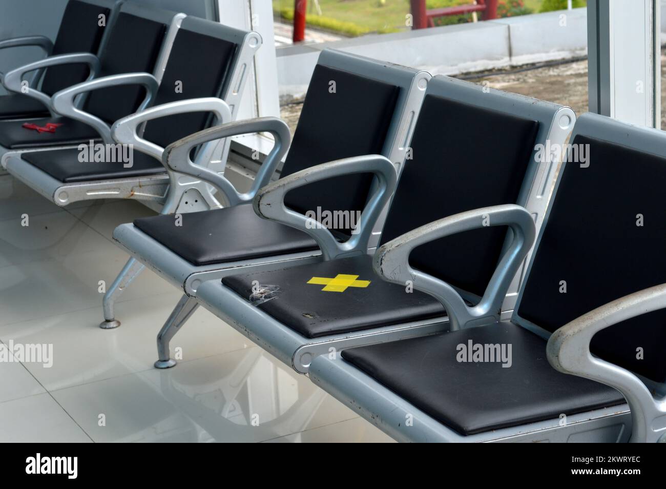 chairs in the waiting room with distance rules Stock Photo Alamy