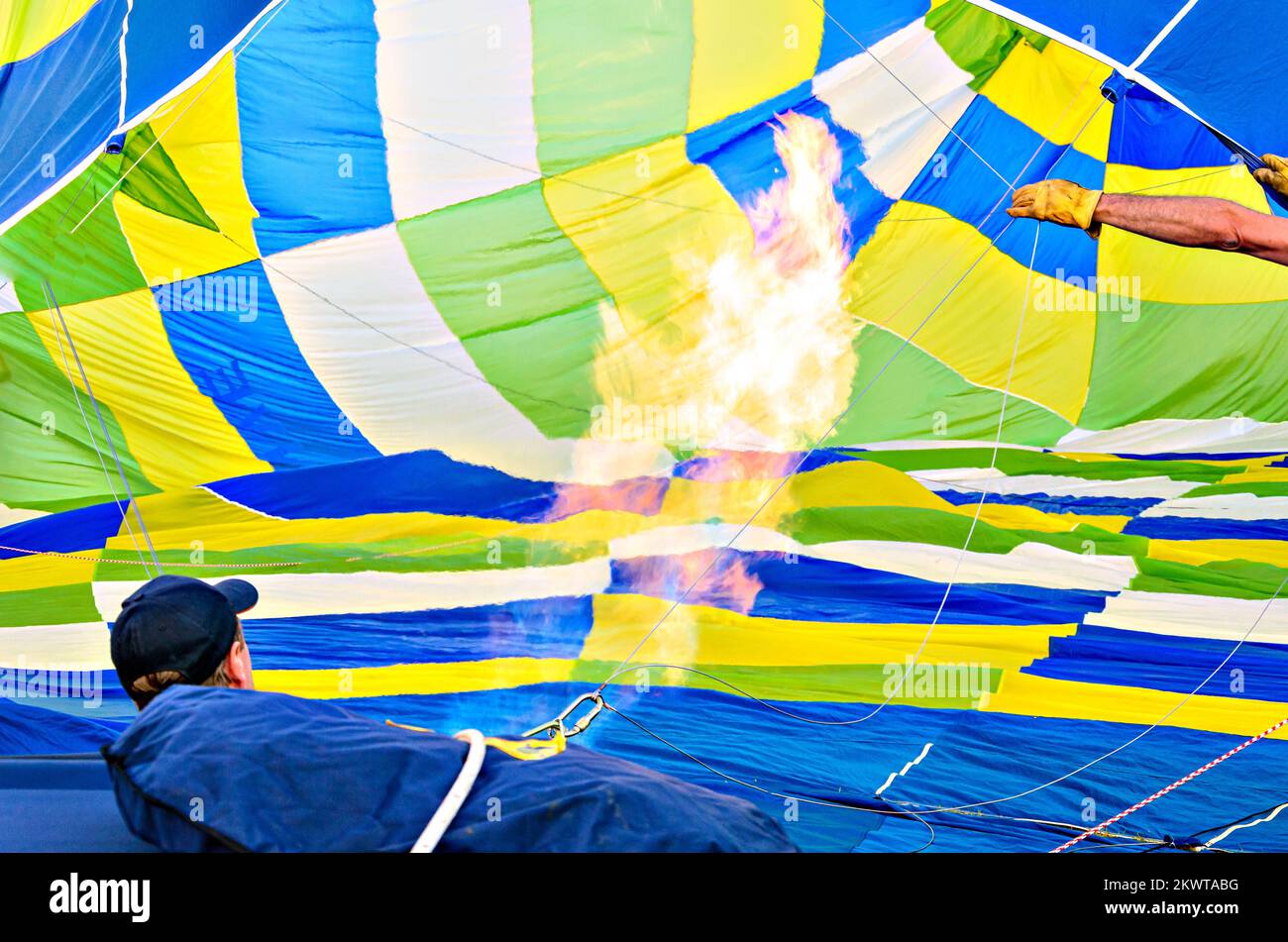 Colorful hot air balloon flying over blue sky with white clouds Stock ...