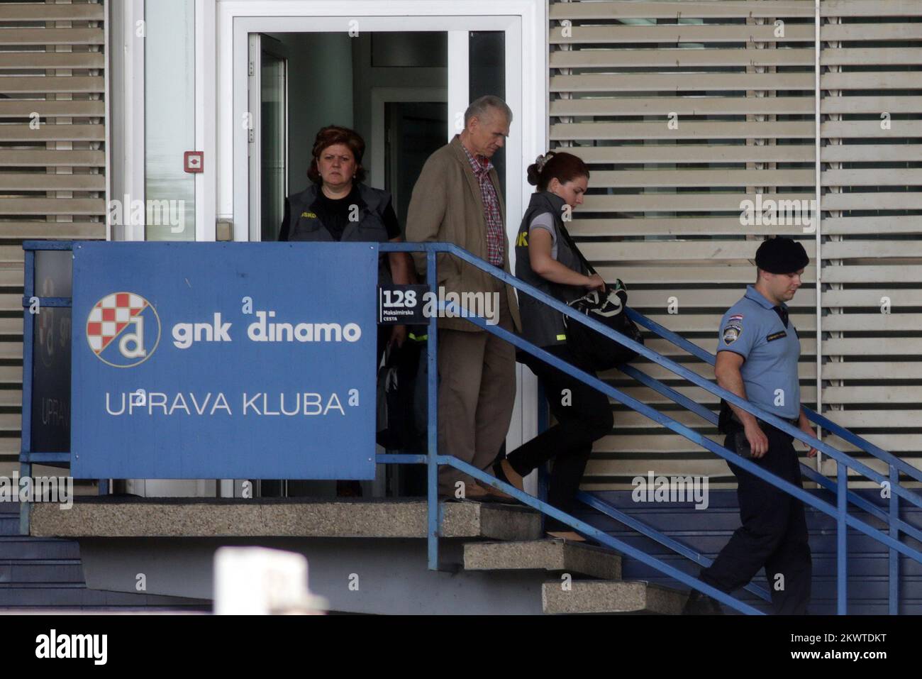 The employees of the Croatian agency fighting corruption and organized crime leaving the Administration of GNK Dinamo. Croatian police on Thursday raided the homes of brothers Zdravko and Zoran Mamic, officials of the nation's largest club Dinamo Zagreb and the most powerful people in the country's football. The search has been ordered by the Croatian agency fighting corruption and organized crime (Uskok) in connection with tax evasion suspicions, the Mamics confirmed in a statement released by Dinamo.   Stock Photo