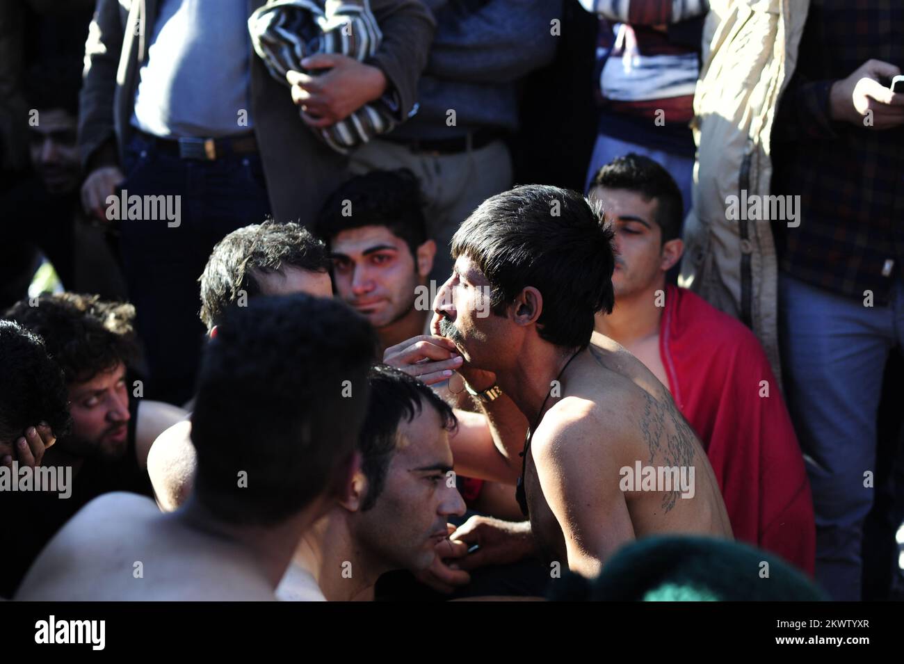 23.11.2015., Gevgelija, Macedonia - Migrants have blocked rail traffic at the Macedonian border as they protested against a decision to only allow Syrians, Afghans and Iraqis to cross there from Greece. Several sewed their lips together with cord, with at least one declaring a hunger strike before sitting down in front of lines of Macedonian riot police. Photo: HaloPix/PIXSELL Stock Photo