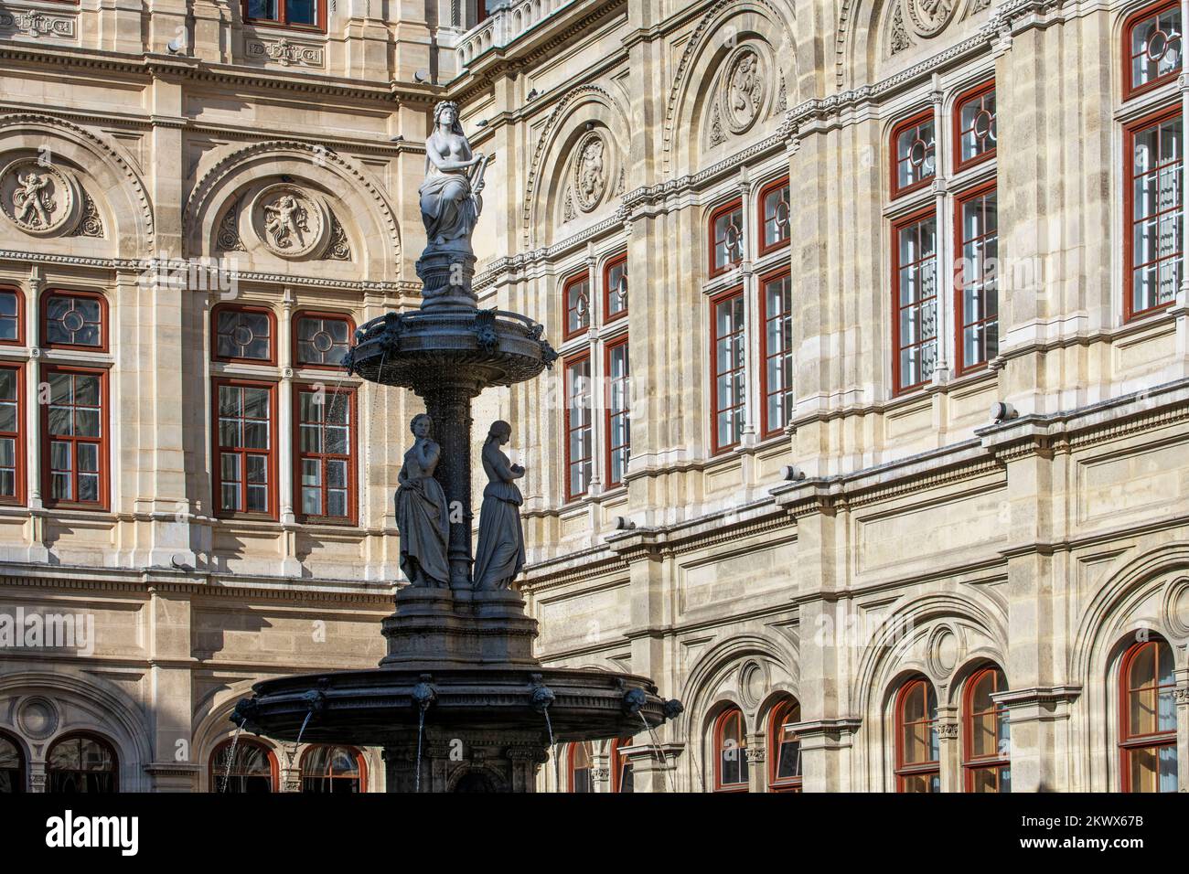 Opera Fountain (Opernbrunnen) at Vienna State Opera (Wiener Staatsoper) - Vienna, Austria. Opernbrunnen - 'unter der bekrönenden Allegorie der Musik' Stock Photo