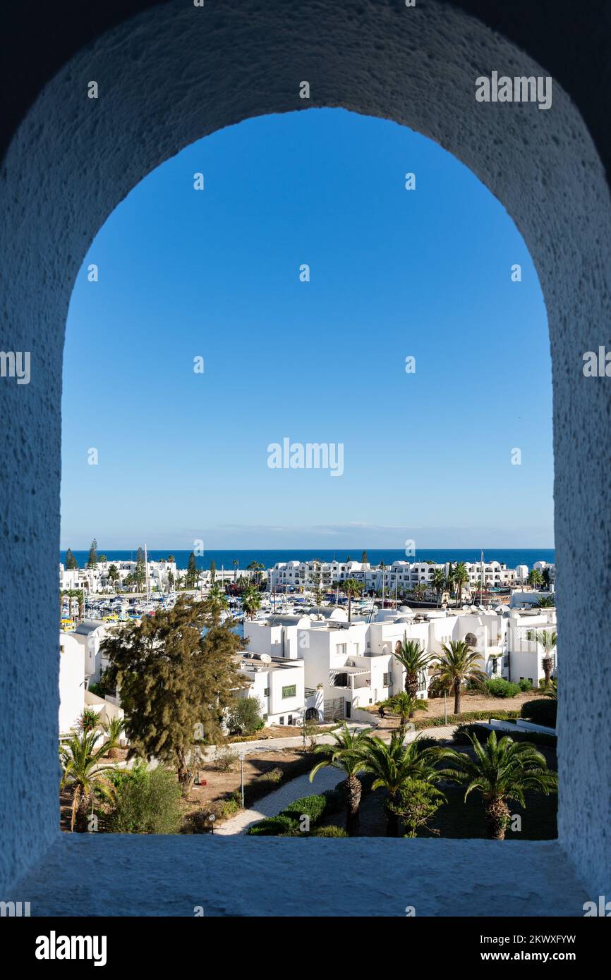 Arch window of the hotel with the beautiful Mediterranean Sea in Sousse, Tunisia. Blue concept. Stock Photo