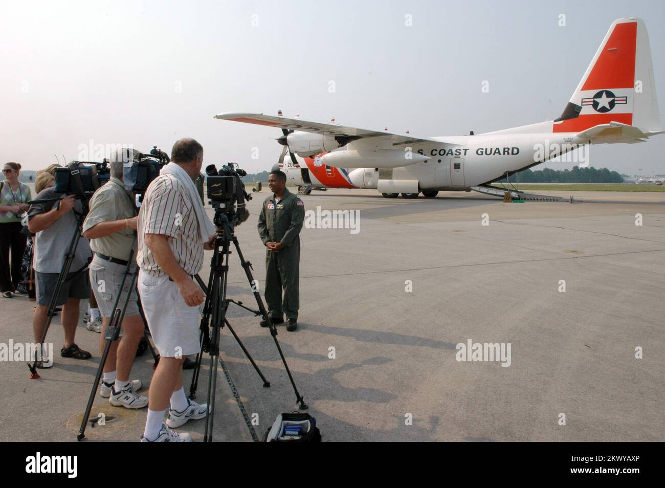 Marietta, GA, August 16, 2007   U.S. Coast Guard Pilot Lt. Jo'Andrew Cousins speaks to the press upon arrival to Dobbins Air Reserve Base. The Coast Guard is flying the FEMA Federal Incident Response Support Team (FIRSTeam) to Puerto Rico in advance of Hurricane Dean. Mark Wolfe/FEMA.. Photographs Relating to Disasters and Emergency Management Programs, Activities, and Officials Stock Photo
