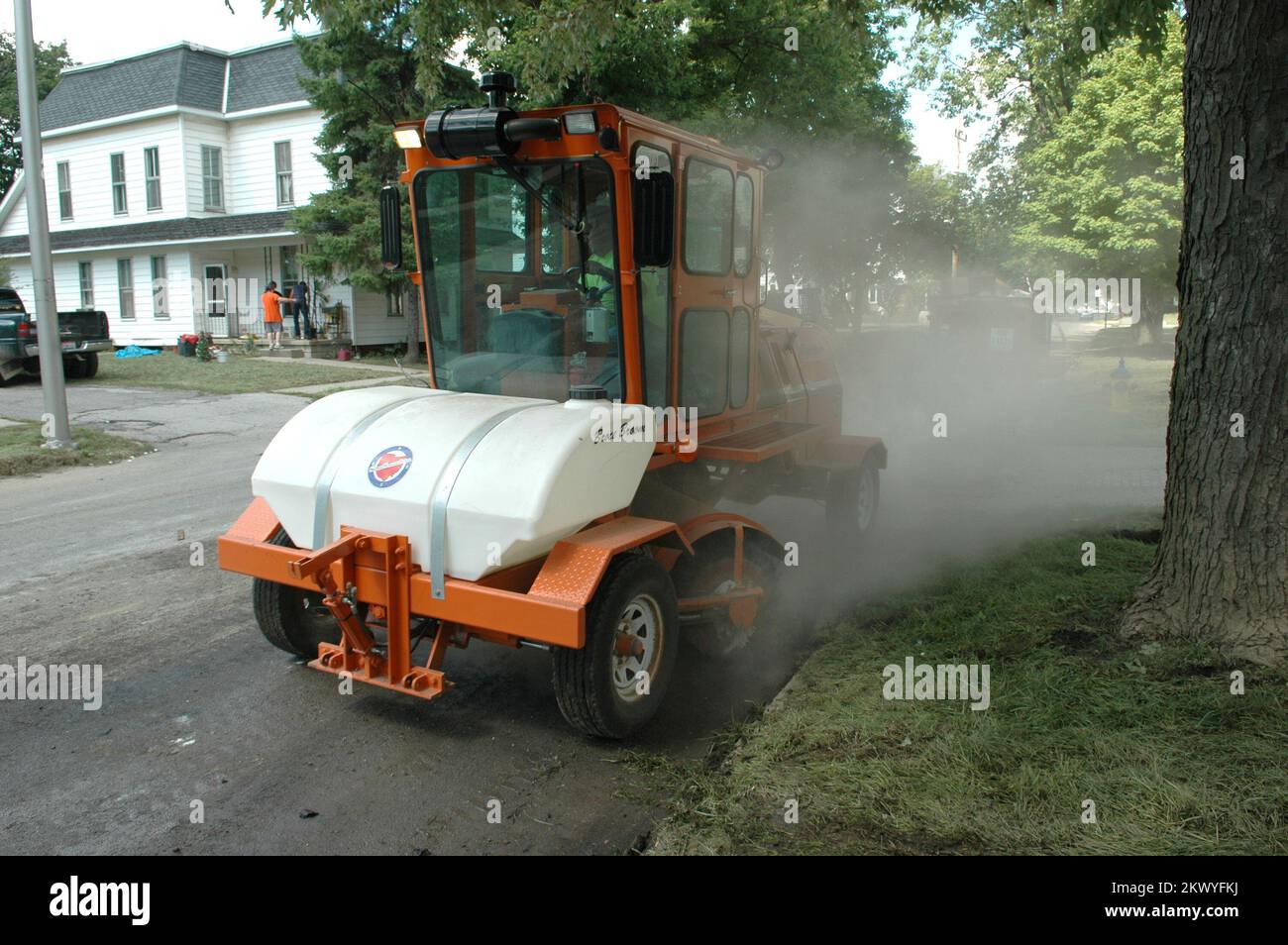 Severe Storms, Flooding, and Tornadoes,  Ottawa, Ohio, August 27, 2007   A Ohio Dept. of Transportation street cleaner follows along after the pick up of debris caused by flooding of the Blanchard River. The recent floods affected several North Central Ohio towns. Mark Wolfe/FEMA.. Photographs Relating to Disasters and Emergency Management Programs, Activities, and Officials Stock Photo