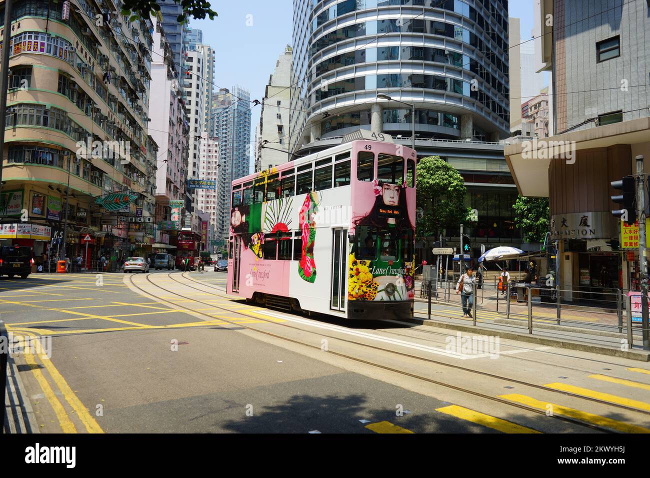 HONG KONG - APRIL 16, 2015: Double-decker trams on street of Hong Kong ...