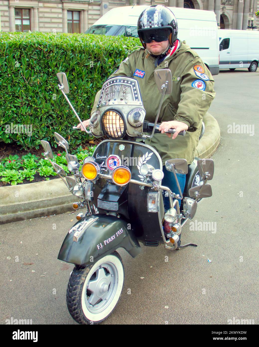 Glasgow, Scotland, UK 30th November, 2022. George square gears up for Christmas and a member of the Glasgow scooter club poses in the city centre hub with his mod iconic scooter dedicated to the movement and Fred perry in particular. Gerard Ferry/Alamy Live News Stock Photo