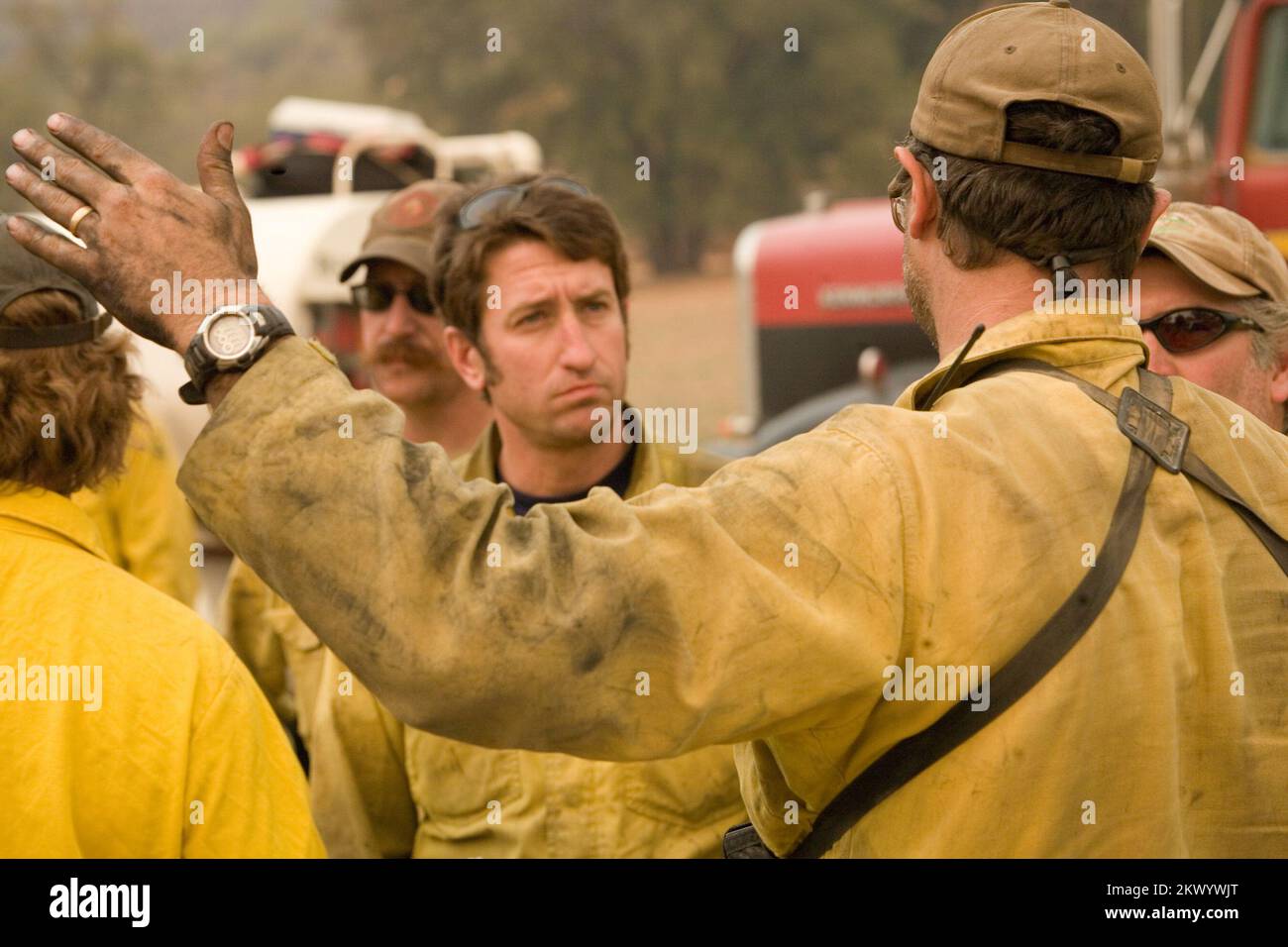Wildfires,  San Diego, CA, October 27, 2007   Firefighters discuss fire behavior on the Harris fire, near the Mexican border. Currently the fires in Southern California have burned nearly 350,000 acres. Andrea Booher/FEMA.. Photographs Relating to Disasters and Emergency Management Programs, Activities, and Officials Stock Photo