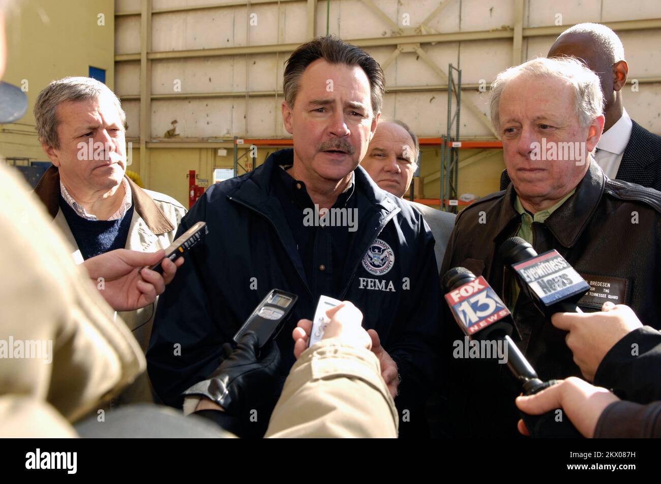 Severe Storms, Tornadoes, Straight-line Winds, and Flooding,  Memphis, TN, 02/07/2008   FEMA Administrator David Paulison, left and Tennessee Governor Phil Bredesen talk to reporters in the Pinnacle hanger at the Memphis airport. Paulison was there to tour the damage from the recent tornado.. Photographs Relating to Disasters and Emergency Management Programs, Activities, and Officials Stock Photo