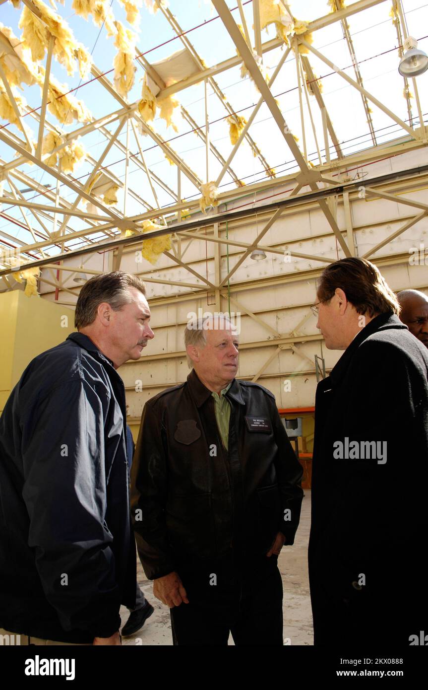 Severe Storms, Tornadoes, Straight-line Winds, and Flooding,  Memphis, TN, 02/07/2008   FEMA Administrator David Paulison talks to Tennessee Governor Phil Bredesen and Philip Trenary, President and CEO of Pinnacle Airline Corp. in the Pinnacle hanger at the Memphis airport. Paulison was there to tour the damage from the recent tornado.. Photographs Relating to Disasters and Emergency Management Programs, Activities, and Officials Stock Photo