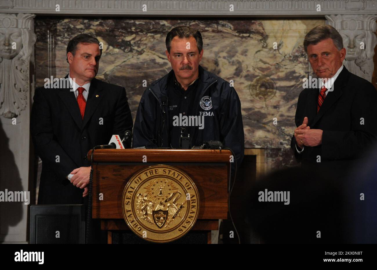 Severe Storms, Tornadoes, and Flooding,  LIttle Rock, AR, March 31, 2008   FEMA Administrator David Paulison, center, responds to reporters at a press conference with Arkansas Governor Mike Beebe, right, and Senator Pryor, left at the Arkansas State House. LIttle Rock, AR-FEMA Admistrator Dave Paulison, center responds to reporters at a press conference  with Arkansas Governor Mike Beebe, right, and Senator Pryor, left  at the State House.. Photographs Relating to Disasters and Emergency Management Programs, Activities, and Officials Stock Photo