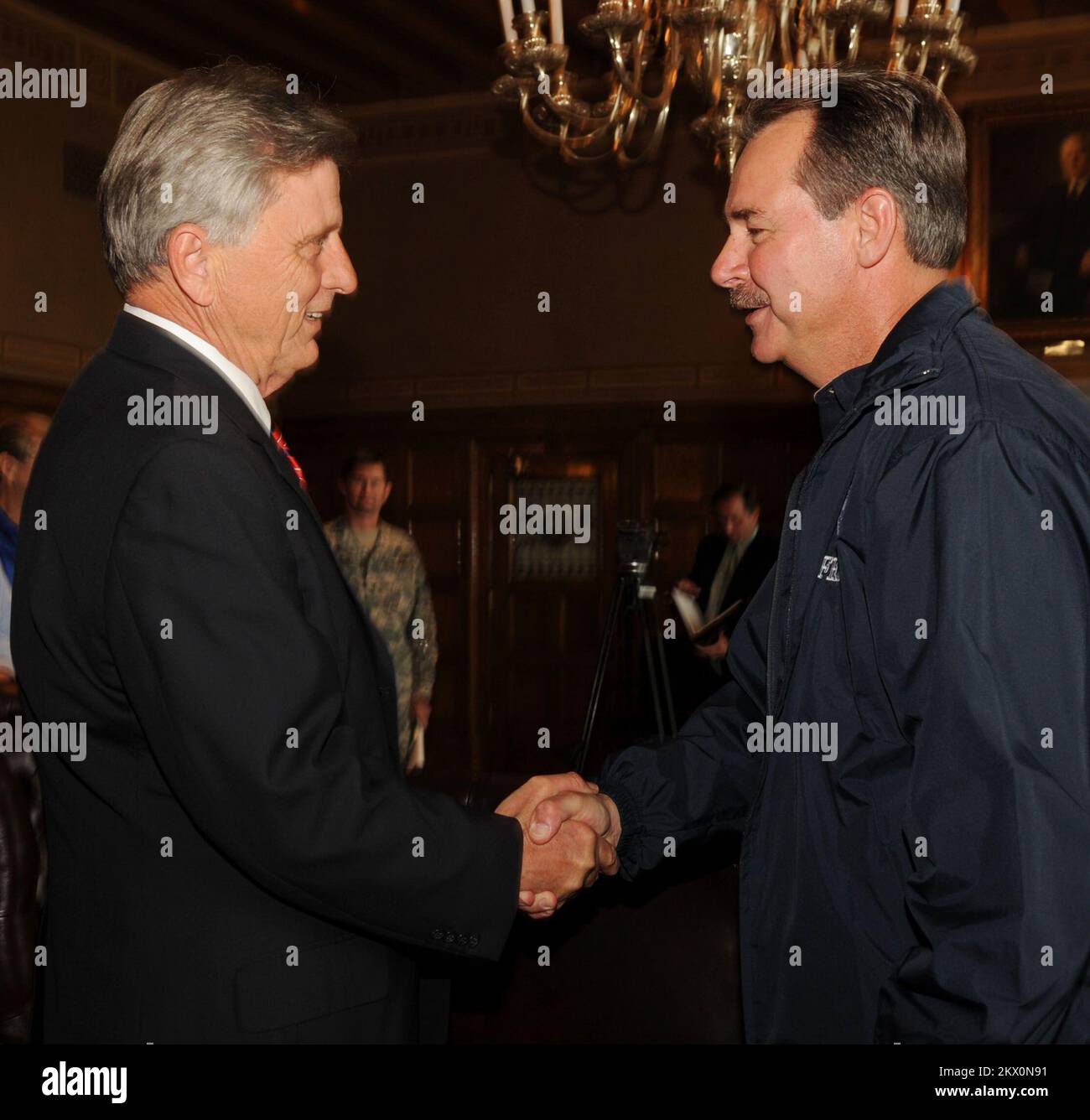 Severe Storms, Tornadoes, and Flooding,  Little Rock, AR, March 31, 2008   FEMA Administrator Dave Paulison, right greets Governor Mike Beebe, at the State House prior to a meeting and press conference. LIttle Rock, AR-FEMA Admistrator Dave Paulison, right greets Governor Mike Beebe, at the State House prior to a meeting and press conference.. Photographs Relating to Disasters and Emergency Management Programs, Activities, and Officials Stock Photo
