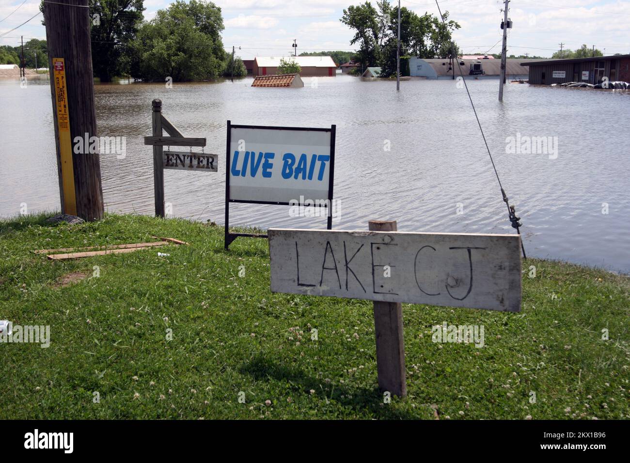 Severe Storms, Tornadoes, and Flooding,  Columbus Junction, IA, June 16, 2008   The flooded section of lower Columbus Junction now has sign that names a newly created lake, thanks to an anonymous resident. The high water from the rain-swelled Iowa and Cedar rivers broke through the town's levee on Saturday night.. Photographs Relating to Disasters and Emergency Management Programs, Activities, and Officials Stock Photo