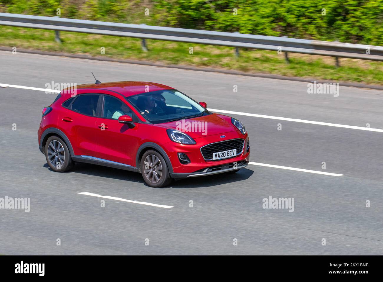 2020 Red FORD PUMA TITANIUM FIRST EDITION ED MHEV 999cc 6 speed Manual Hybrid; travelling on the M6 Motorway UK Stock Photo