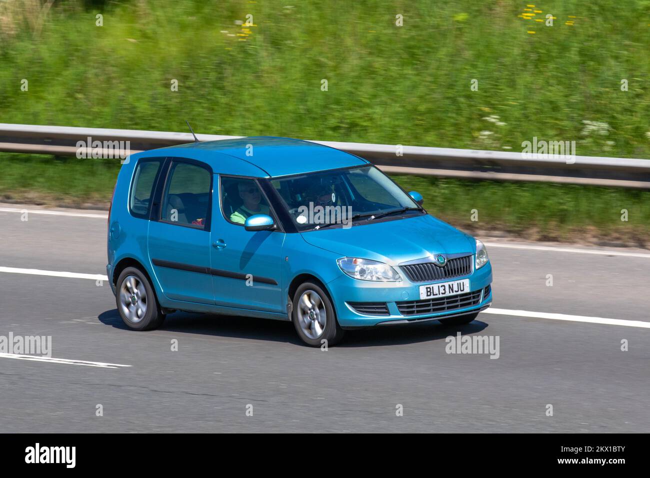 2013 Blue SKODA ROOMSTER 1197cc petrol 7 speed aut. met dubb. koppeling; travelling on the M6 Motorway UK Stock Photo