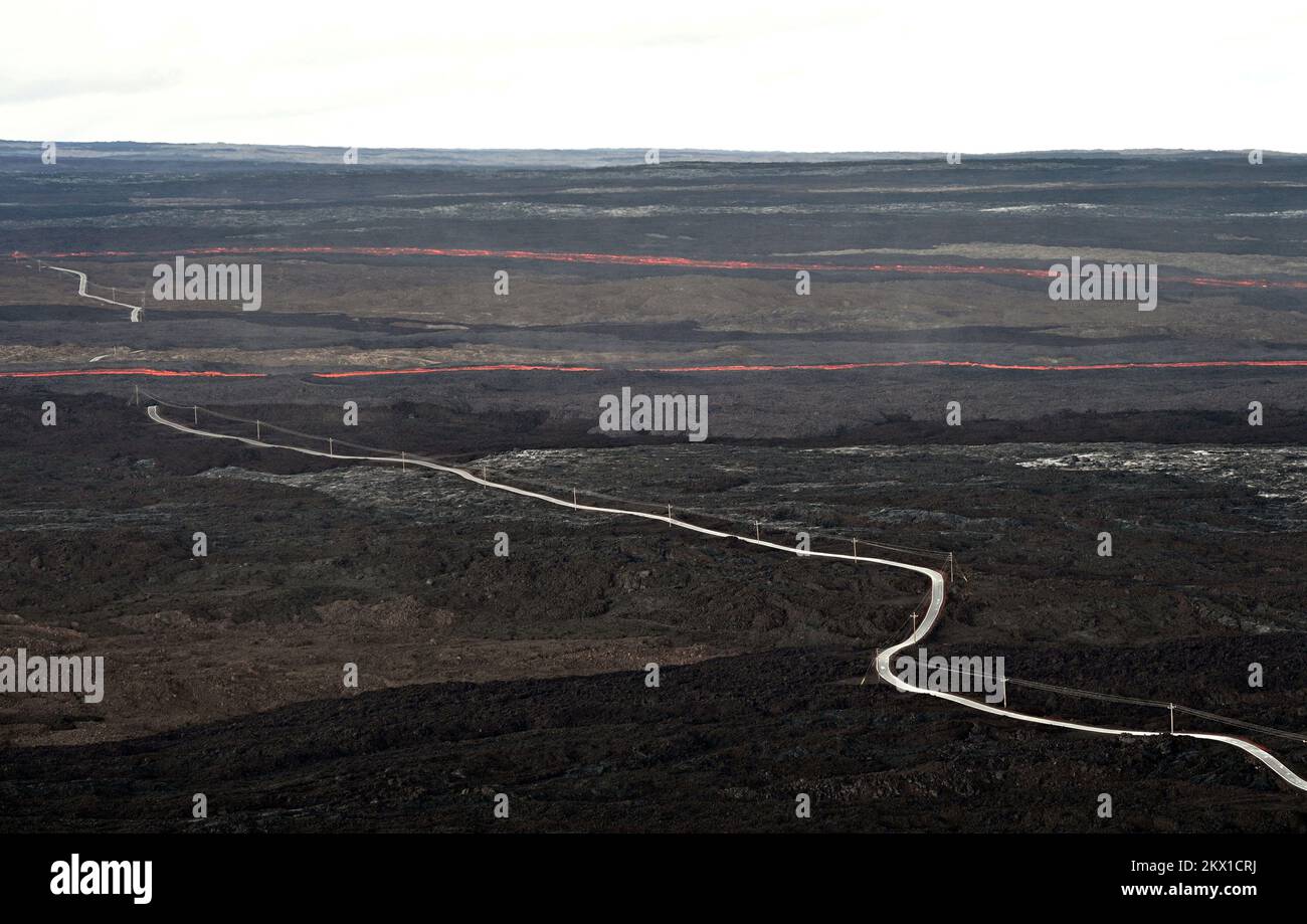 Mauna Loa, United States of America. 29 November, 2022. Lava flows cut across the Mauna Loa Observatory Road during an eruption in the Northeast Rift Zone on the caldera summit of Mauna Loa at Hawaii Volcanoes National Park, November 29, 2022 in Hawaii. The new eruption, which is the first since 1984 in the worlds largest active volcano. Credit: Alisa L. Gallant/USGS/Alamy Live News Stock Photo